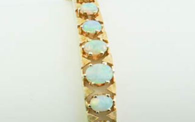 14K YELLOW GOLD AND PRECIOUS WHITE OPAL HINGED OVAL BANGLE...