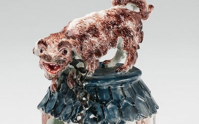 A Meissen porcelain model of a barking dog on its kennel