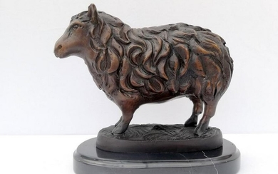 Bronze sheep sculpture on marble base