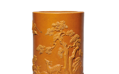 A CARVED YELLOW-ENAMELLED ‘DEER AND CRANE’ BRUSHPOT, DAOGUANG PERIOD (1821-1850)