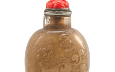 CHINESE TEA CRYSTAL SNUFF BOTTLE In ovoid form, with relief bat and lion carving. Height 2.25". Simulated coral stopper.