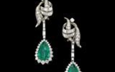 A pair of diamond and emerald ear clip pendants