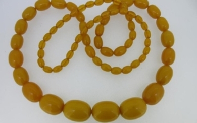A graduated strand of butterscotch amber beads