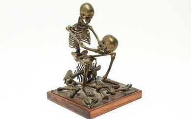 Human Skeleton Holding a Skull Brass Sculpture