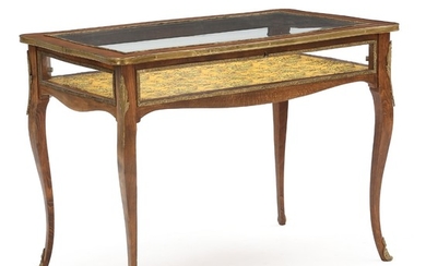 A Rococo style mahogany display table. Last half of the 20th century. H. 75 cm. W. 102 cm. D. 62 cm.