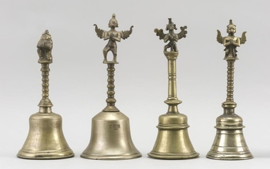 FOUR INDIAN BRASS TEMPLE BELLS One with an elephant handle, height 9.75", one with a bird-like handle, height 11", and two in a simi...