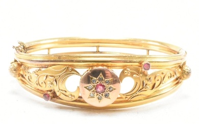 A 19th century gold gem and diamond set hinged bangle. The b...