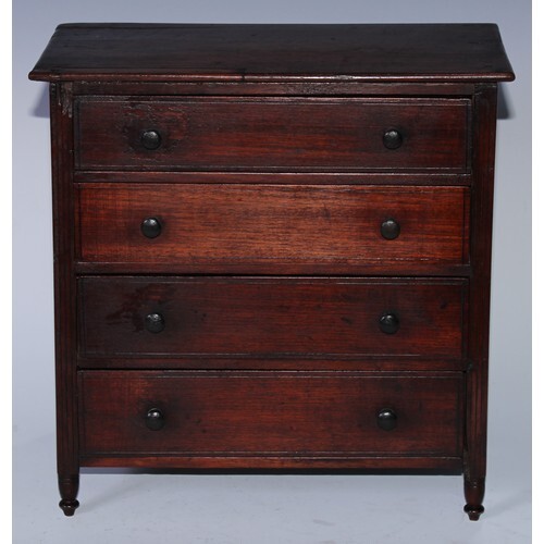 A 19th century mahogany miniature chest, oversailing rectang...