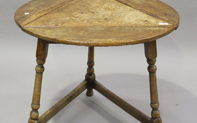 A 20th century provincial style oak drop-flap circular cricket table, on turned legs, height 59cm, d