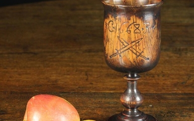 A Charles II Turned Treen Goblet. The bowl incised with initialed C Rx flanking date 1668 above cros