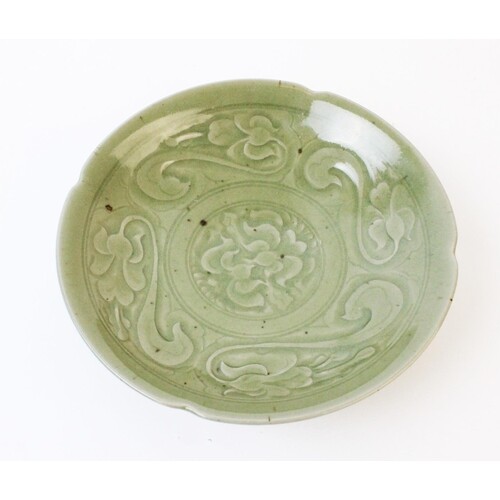 A Chinese Yaozhou celadon bowl, the circular bowl with cuspe...