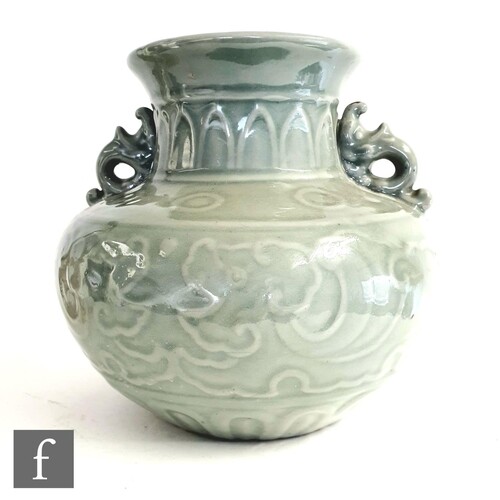 A Chinese celadon Longquan style baluster vase, Qing Dynasty...