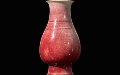 A Chinese copper-red glazed porcelain vase, Qing dynasty 銅紅釉觶瓶