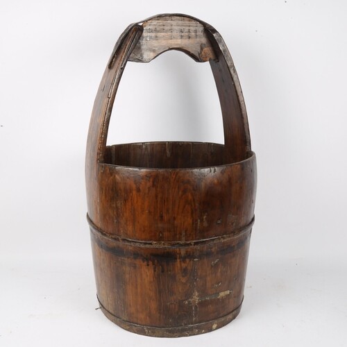A Chinese elm well bucket, with wrought-iron fittings, heigh...