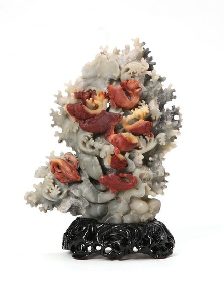 A Chinese hardstone group of koi amidst waves