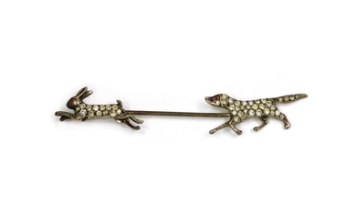 A Continental silver paste set hunting scene pin