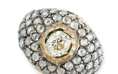 A DIAMOND BOMBE RING set with a central cushion cut