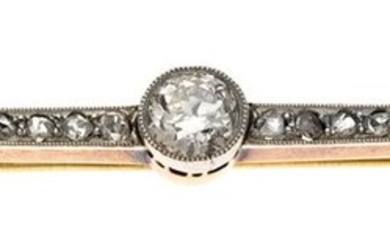 A Diamond Bar Brooch Early 20th Century. One large brilliant cut diamond flanked by two rows of...