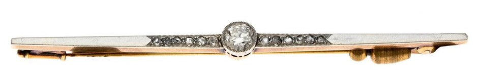 A Diamond Bar Brooch Early 20th Century. One large brilliant cut diamond flanked by two rows of...