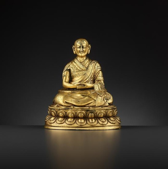 A GILT BRONZE OF THE FIFTH PANCHEN LAMA 17/18TH CT