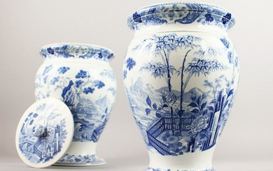 A GOOD PAIR OF WEDGWOOD BLUE AND WHITE VASES WITH LIDS