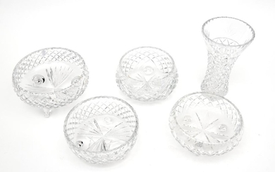 A GROUP OF FOUR CUT CRYSTAL BOWLS AND A FLARED CYLINDRICAL CRYSTAL VASE