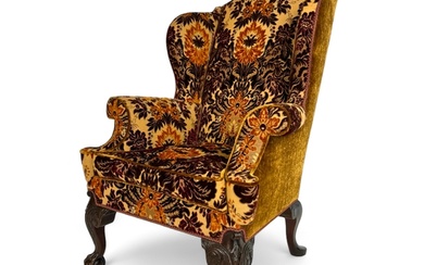 A George II style carved mahogany wing arm chair Upholster...