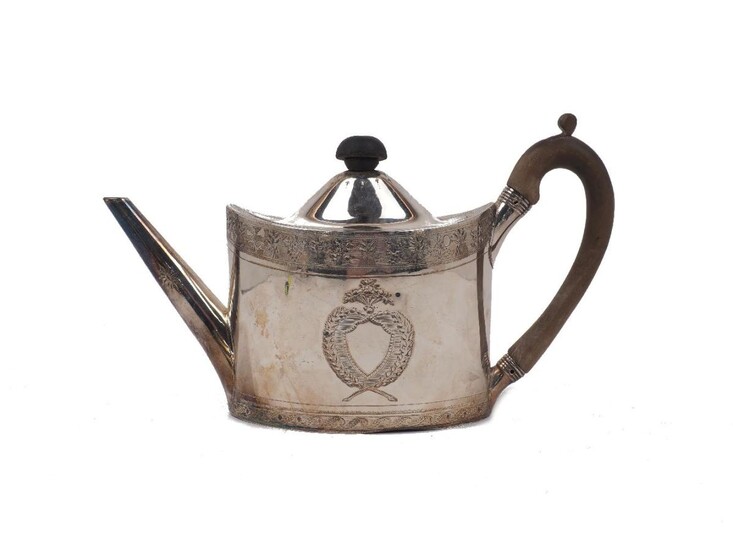 A George III silver teapot, London, 1794, Frances Purton, of oval form with foliate and wheat sheaf engraved band to upper rim and laurel bordered cartouches to body, the lid with rubber finial (replacement) and the wooden handle with pins...
