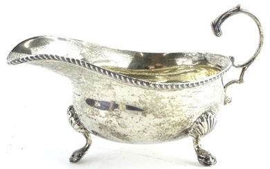 A George V silver sauce boat, with gadrooned edge,...