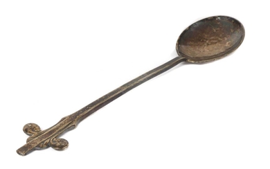A Liberty & Co. Cymric silver jam spoon, designed by Archibald Knox