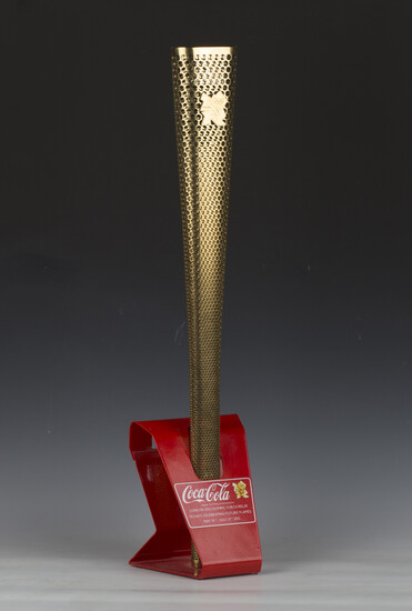 A London 2012 Olympic relay torch, designed by Edward Barber and Jay Osgerby, length 80cm, mounted w