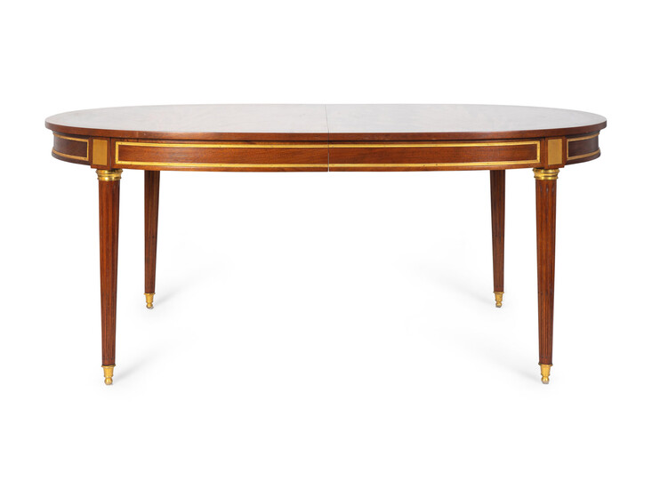 A Louis XVI Style Gilt-Bronze-Mounted Mahogany Extension Dining Table