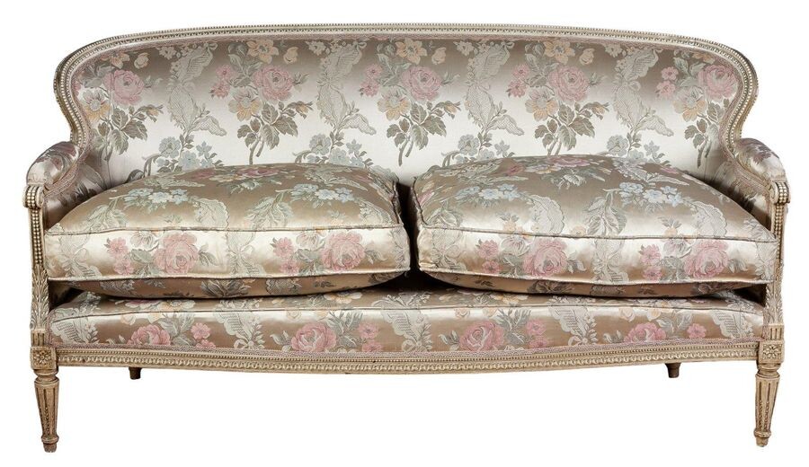 A Louis XVI style white lacquered silk upholstered sofa