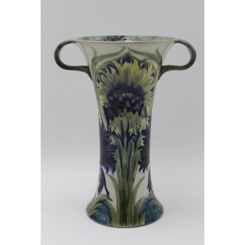 A MOORCROFT POTTERY TWO HANDLED VASE of tapering form, tube ...