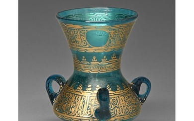 A Middle Eastern gilt blue glass mosque lamp, 19th c, with t...