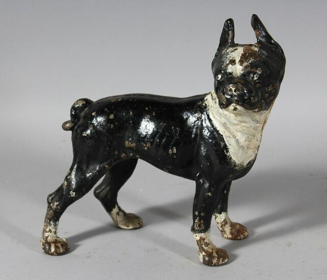 A PAINTED CAST IRON DOG DOORSTOP. 9ins long.