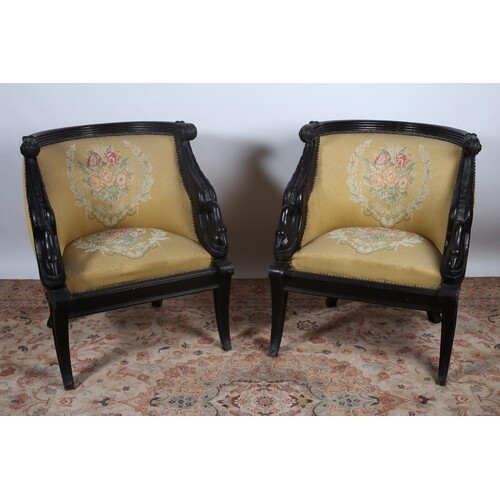 A PAIR OF EMPIRE DESIGN EBONISED CARVED TUB SHAPED CHAIRS ea...