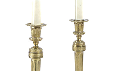 A PAIR OF FRENCH GILT BRASS CANDLESTICK LAMPS...