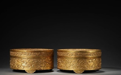 A PAIR OF GILT-BRONZE COVERED BOXES