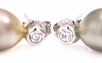 A PAIR OF TAHITIAN PEARL STUD EARRINGS; 8.5 x 9mm drop shape cultured pearls on sterling silver posts set zirconias.