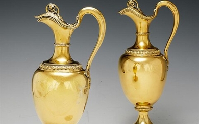 A PAIR OF VICTORIAN SILVER GILT OVOID CLARET JUGS BY GARRARD & CO. LONDON 1856 Stamped for R. & S.