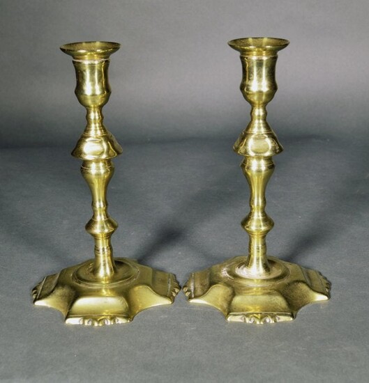 A Pair of English Brass Petal-base Candlesticks