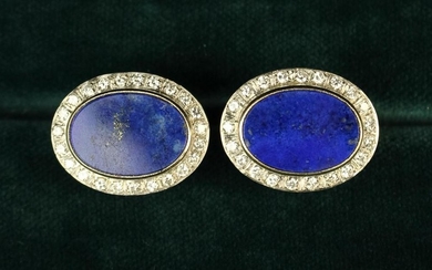 A Pair of Fine Diamond & Lapis Lazuli Cuff Studs; the flat oval lapis mounts bordered by diamonds.