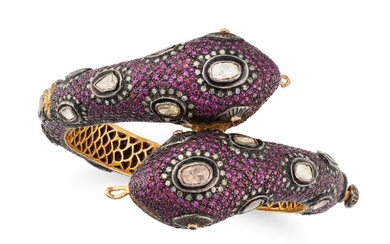 A RUBY AND DIAMOND SNAKE BANGLE the hinged bangle designed as a double headed snake, set throughout