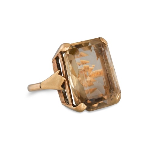A SMOKY QUARTZ DRESS RING, mounted in 9ct yellow gold, with ...