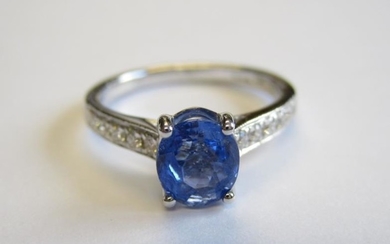 A Sapphire and Diamond Ring claw-set oval-cut sapphire, 1.24cts,...