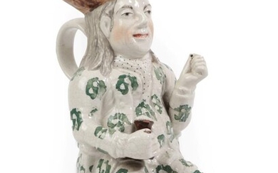 A Staffordshire Pottery Squire Toby Jug, 19th century, the seated...