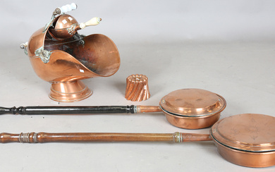 A Victorian copper jelly mould, stamped 'Jones Bros', height 10cm, together with a Victori