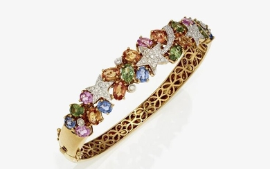 A bangle with star motifs and multi-coloured sapphires