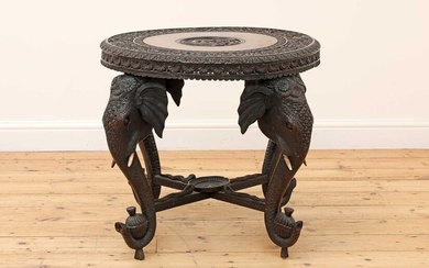A carved rosewood centre table